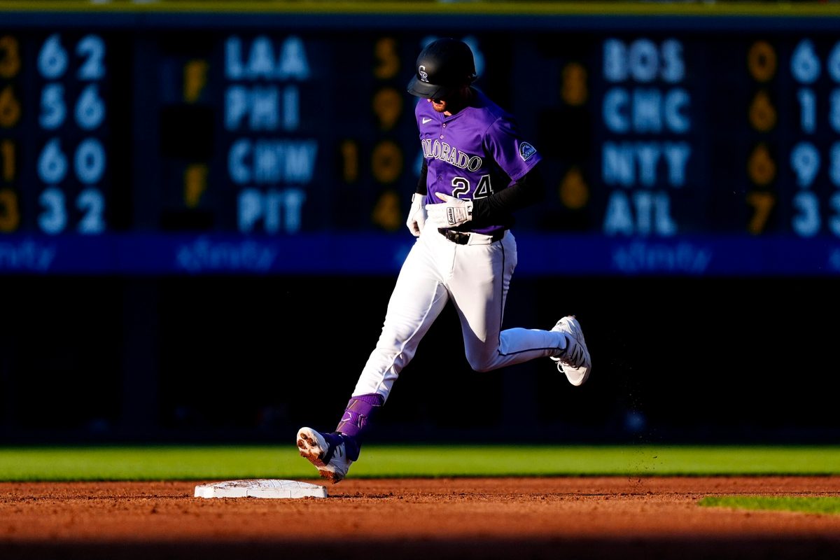 Jul 19, 2025; Denver, Colorado, USA; Colorado Rockies third base Ryan McMahon (24) runs off a two-run home run in the third inning against the Minnesota Twins at Coors Field. Mandatory Credit: Ron Chenoy-Imagn Images