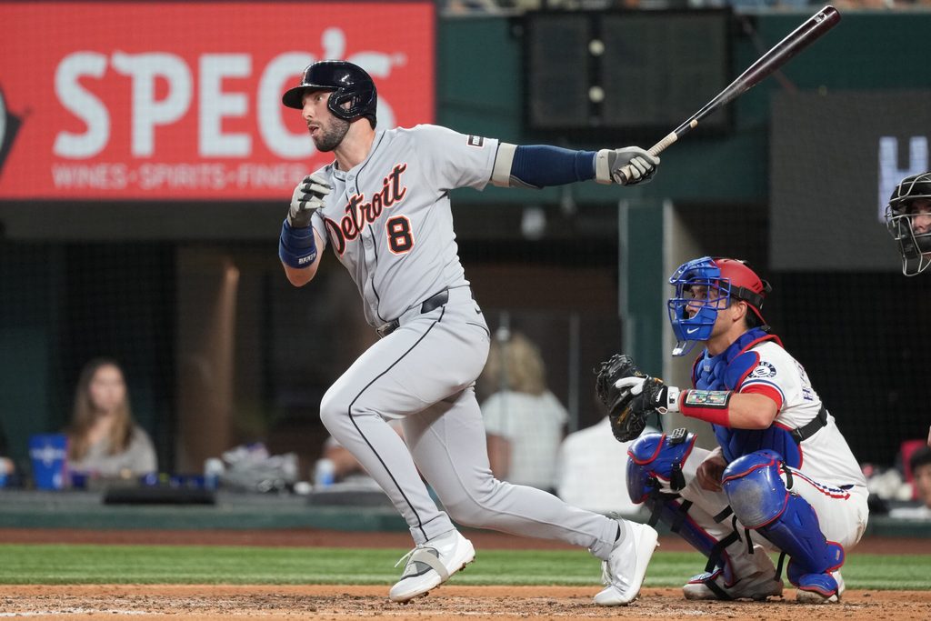 Jul 19, 2025; Arlington, Texas, USA; Detroit Tigers center fielder Matt Vierling (8) follows through on his single against the Texas Rangers during the seventh inning at Globe Life Field. Mandatory Credit: Jim Cowsert-Imagn Images