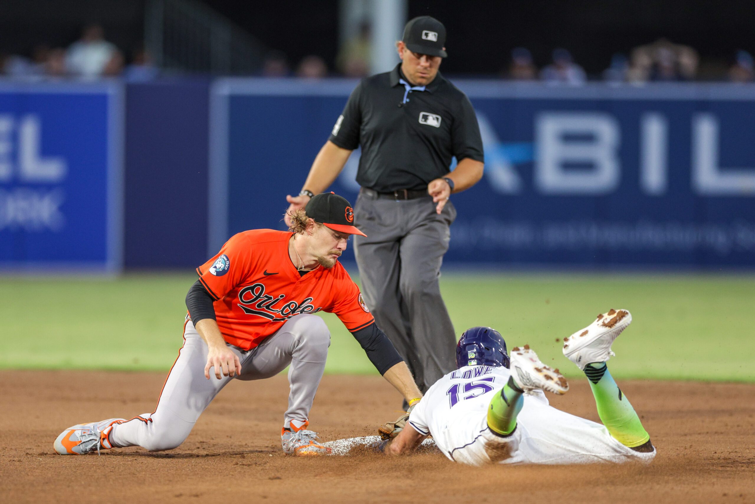 Jul 19, 2025; Tampa, Florida, USA; Tampa Bay Rays right fielder Josh Lowe (15) is caught stealing by Baltimore Orioles shortstop Gunnar Henderson (2) in the fifth inning at George M. Steinbrenner Field. Mandatory Credit: Nathan Ray Seebeck-Imagn Images