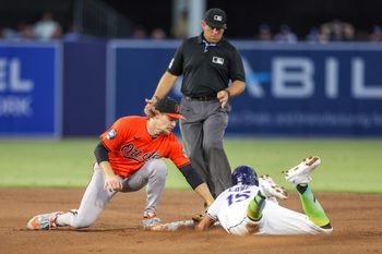 Jul 19, 2025; Tampa, Florida, USA; Tampa Bay Rays right fielder Josh Lowe (15) is caught stealing by Baltimore Orioles shortstop Gunnar Henderson (2) in the fifth inning at George M. Steinbrenner Field. Mandatory Credit: Nathan Ray Seebeck-Imagn Images