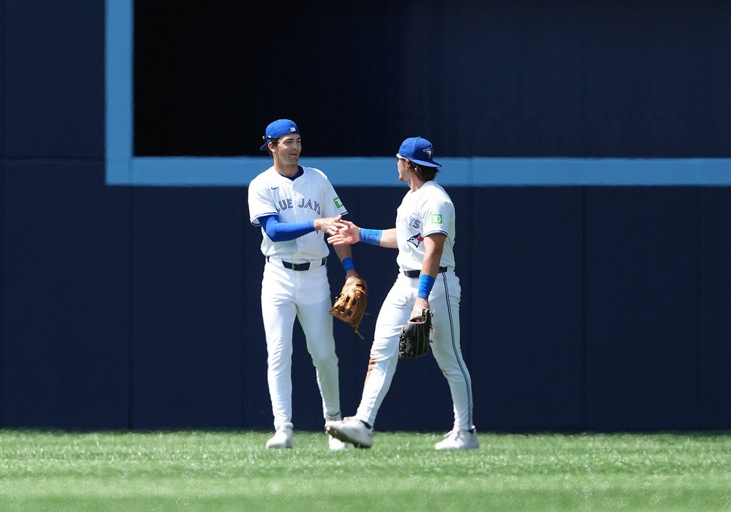 Jul 20, 2025; Toronto, Ontario, CAN; Toronto Blue Jays centre fielder Joey Loperfido (10) celebrates the win with right fielder Addison Barger (47) against the San Francisco Giants at the end of the ninth inning at Rogers Centre. Mandatory Credit: Nick Turchiaro-Imagn Images