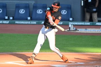 Jul 21, 2025; Cleveland, Ohio, USA; Baltimore Orioles shortstop Gunnar Henderson (2) hits an RBI single in the first inning against the Cleveland Guardians at Progressive Field. Mandatory Credit: David Richard-Imagn Images