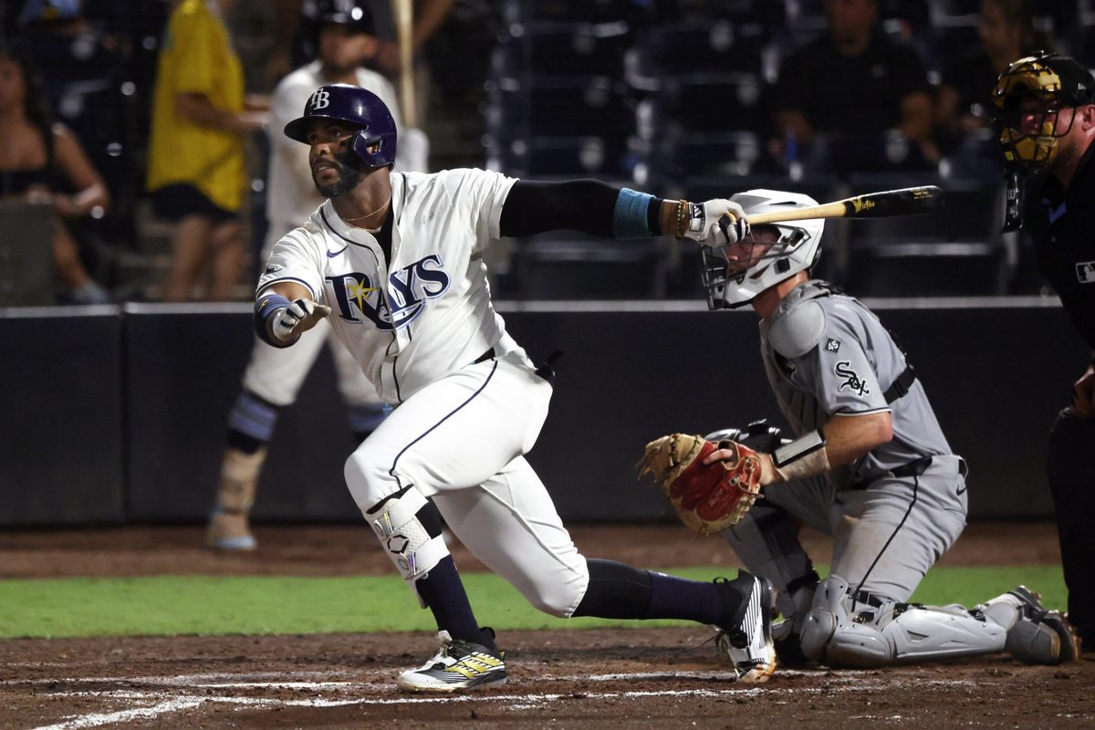Jul 21, 2025; St. Petersburg, Florida, USA;  Tampa Bay Rays designated hitter Yandy Diaz (2) hits a home run during the seventh inning against the Chicago White Sox at George M. Steinbrenner Field. Mandatory Credit: Kim Klement Neitzel-Imagn Images