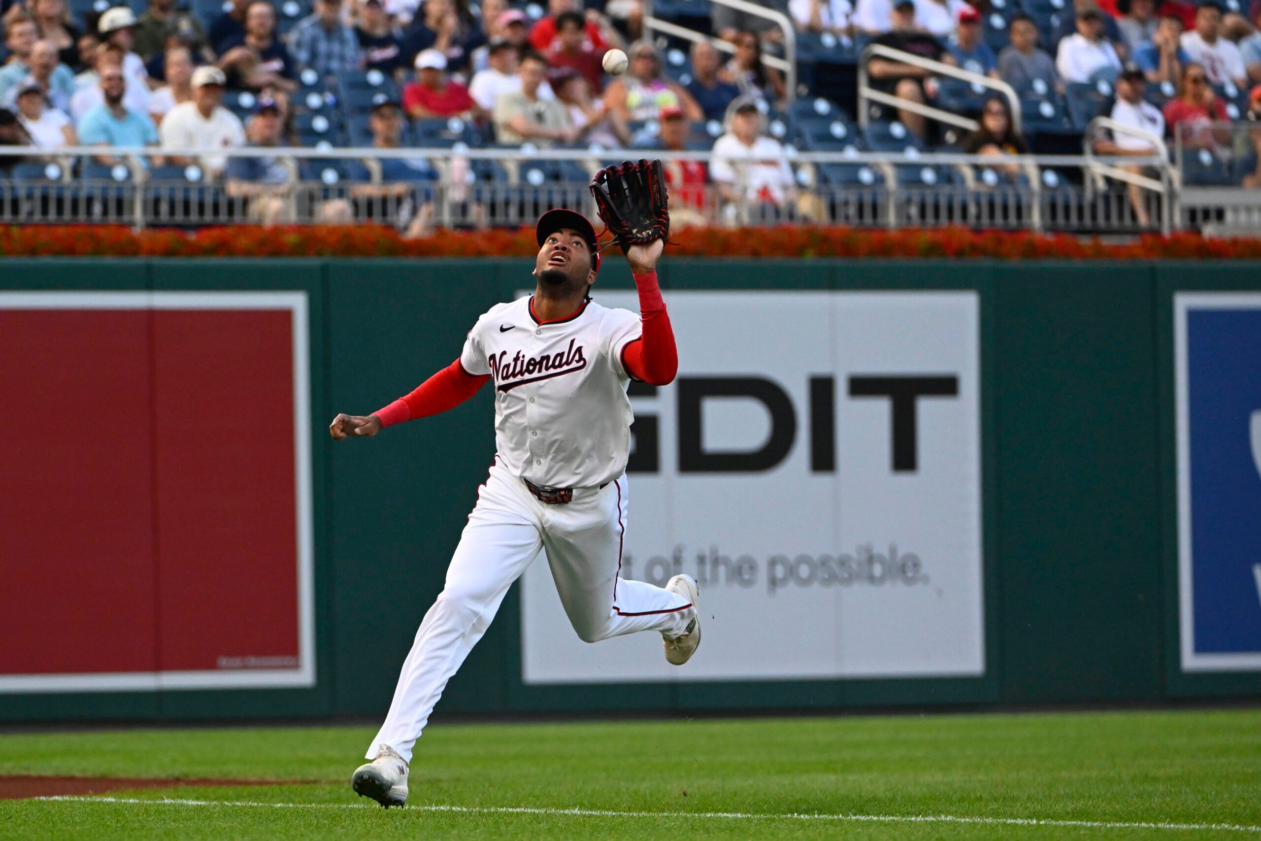 Jul 22, 2025; Washington, District of Columbia, USA; Washington Nationals left fielder James Wood (29) catches the fly ball hit by Cincinnati Reds right fielder Jake Fraley (27) to end the second inning at Nationals Park. Mandatory Credit: Brad Mills-Imagn Images