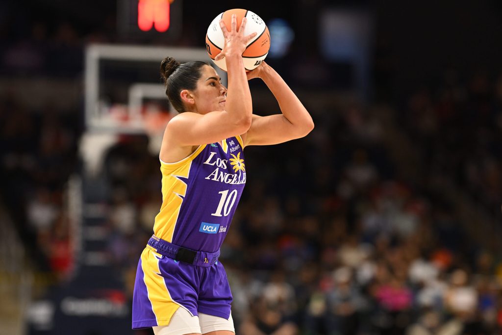 Jul 22, 2025; Washington, District of Columbia, USA; Los Angeles Sparks guard Kelsey Plum (10) attempts a jump shot against the Washington Mystics during the first quarter at CareFirst Arena. Mandatory Credit: Rafael Suanes-Imagn Images