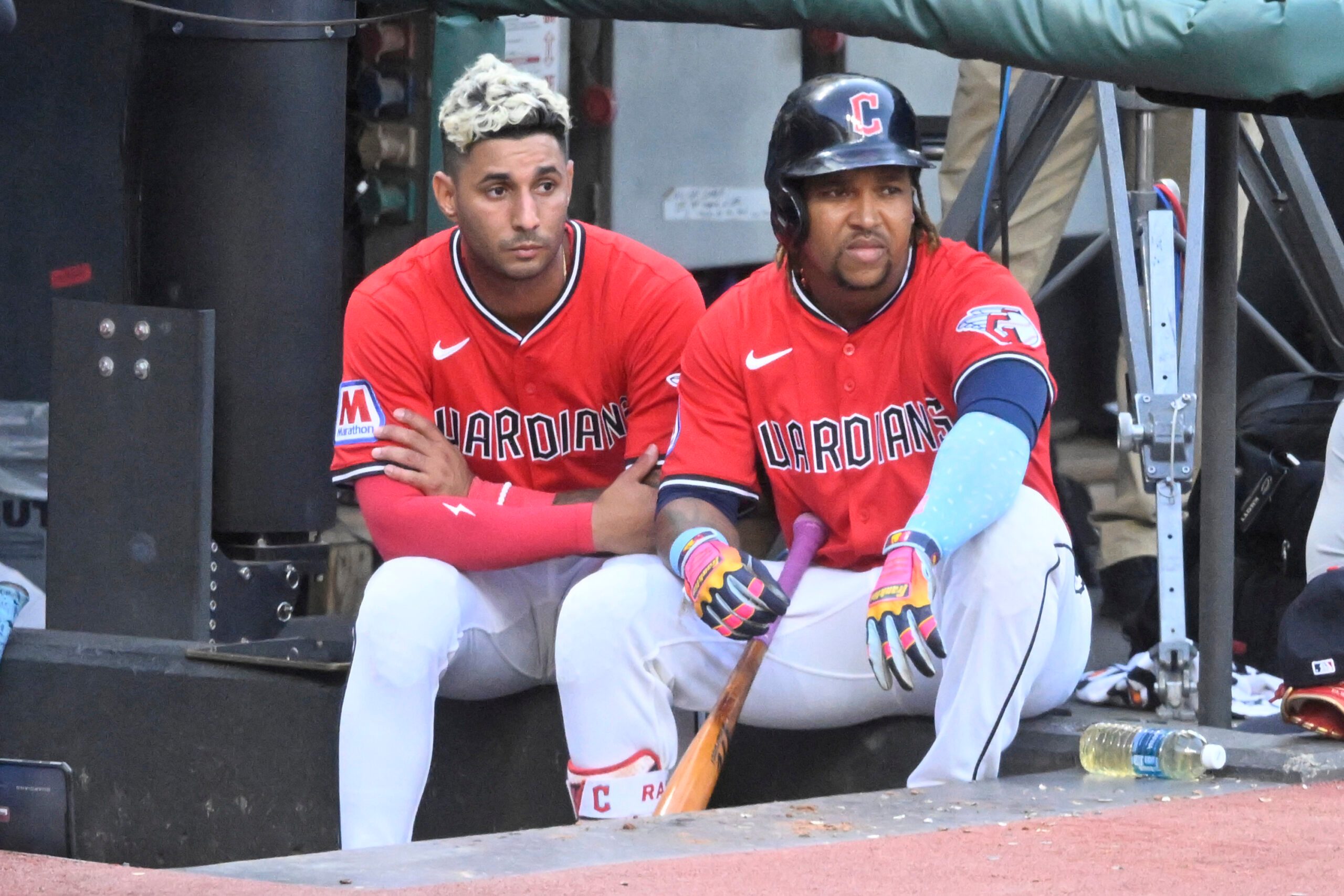 Jul 22, 2025; Cleveland, Ohio, USA; Cleveland Guardians shortstop Brayan Rocchio (4) and third baseman Jose Ramirez (11) sit in the dugout in the fifth inning against the Baltimore Orioles at Progressive Field. Mandatory Credit: David Richard-Imagn Images