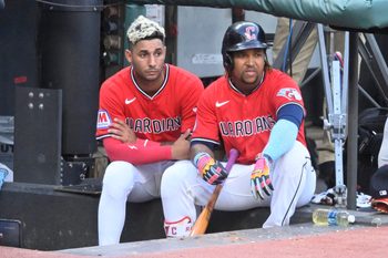 Jul 22, 2025; Cleveland, Ohio, USA; Cleveland Guardians shortstop Brayan Rocchio (4) and third baseman Jose Ramirez (11) sit in the dugout in the fifth inning against the Baltimore Orioles at Progressive Field. Mandatory Credit: David Richard-Imagn Images
