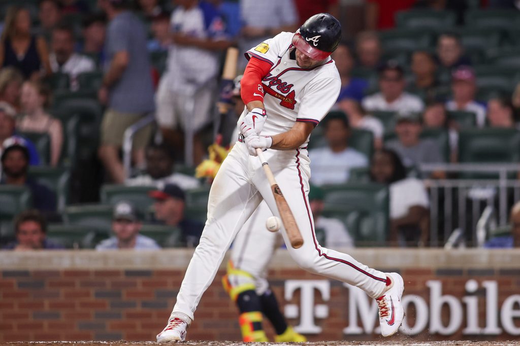 Jul 22, 2025; Atlanta, Georgia, USA; Atlanta Braves first baseman Matt Olson (28) hits a single against the San Francisco Giants in the seventh inning at Truist Park. Mandatory Credit: Brett Davis-Imagn Images