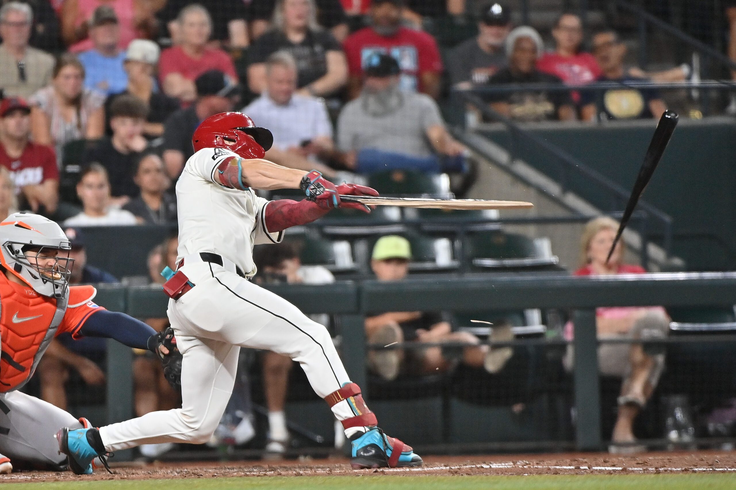 Jul 23, 2025; Phoenix, Arizona, USA; Arizona Diamondbacks outfielder Corbin Carroll (7) break his bat in the fifth inning against the Houston Astros at Chase Field. Mandatory Credit: Matt Kartozian-Imagn Images