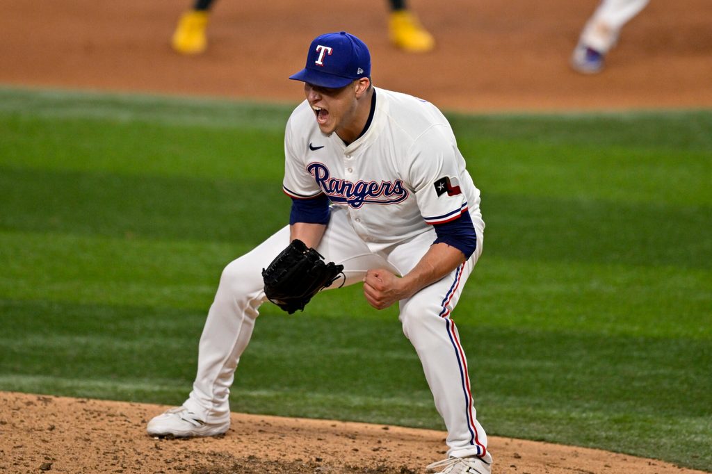 Jul 23, 2025; Arlington, Texas, USA; Texas Rangers relief pitcher Robert Garcia (62) celebrates after he pitches against the Athletics during the ninth inning at Globe Life Field. Mandatory Credit: Jerome Miron-Imagn Images