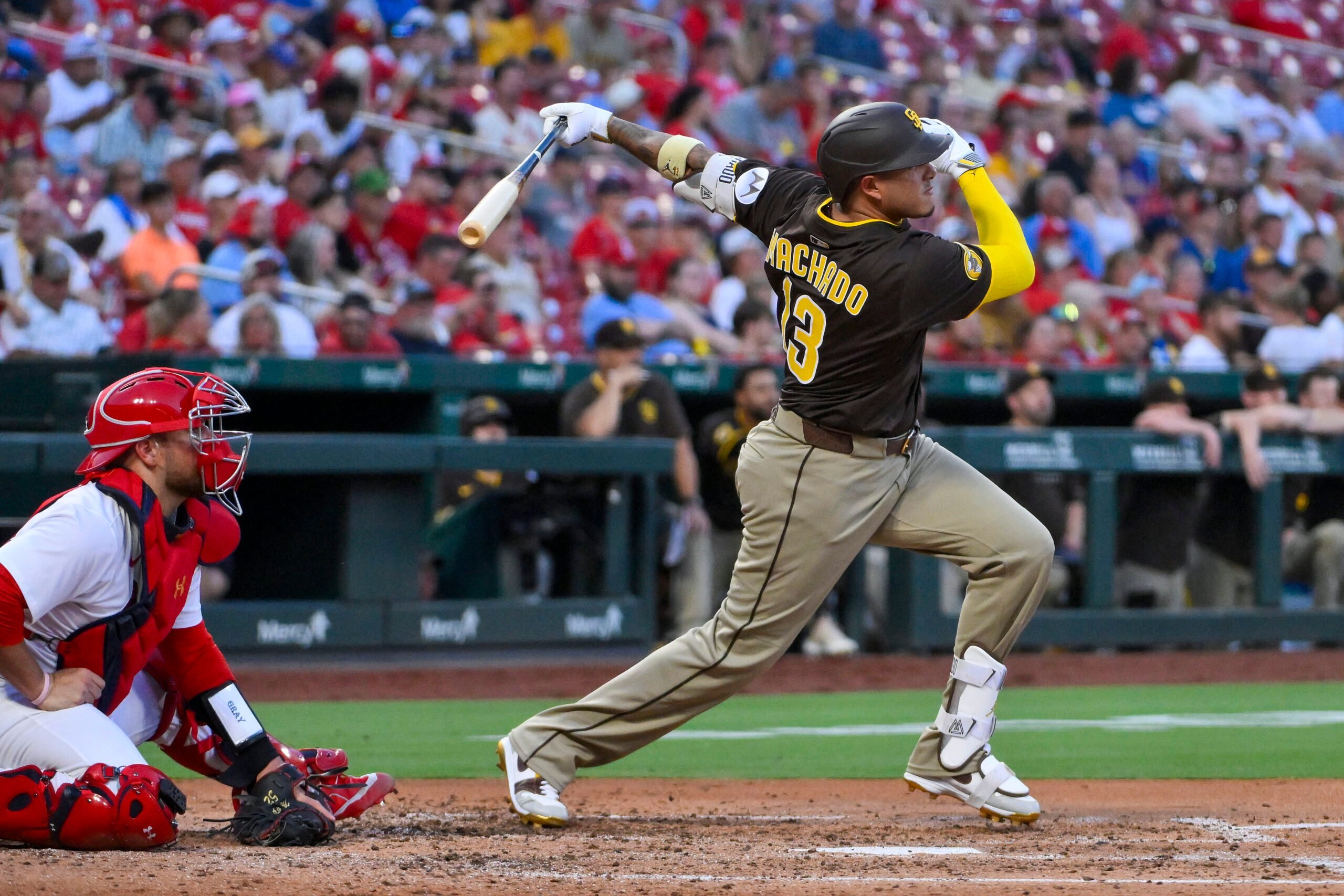 Jul 24, 2025; St. Louis, Missouri, USA;  San Diego Padres third baseman Manny Machado (13) hits a two run home run against the St. Louis Cardinals during the third inning at Busch Stadium. Mandatory Credit: Jeff Curry-Imagn Images