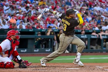 Jul 24, 2025; St. Louis, Missouri, USA;  San Diego Padres third baseman Manny Machado (13) hits a two run home run against the St. Louis Cardinals during the third inning at Busch Stadium. Mandatory Credit: Jeff Curry-Imagn Images