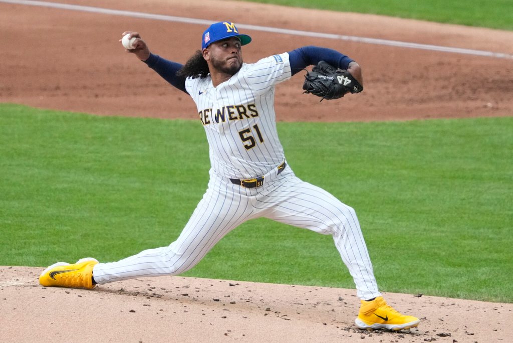 Jul 25, 2025; Milwaukee, Wisconsin, USA; Milwaukee Brewers pitcher Freddy Peralta (51) delivers a pitch against the Miami Marlins in the second inning at American Family Field. Mandatory Credit: Michael McLoone-Imagn Images