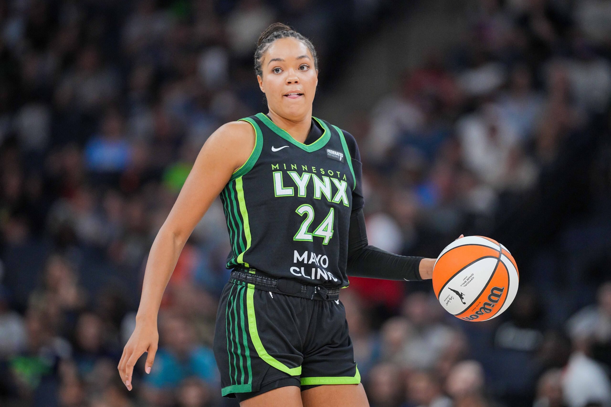 Jul 25, 2025; Minneapolis, Minnesota, USA; Minnesota Lynx forward Napheesa Collier (24) dribbles against the Las Vegas Aces in the third quarter at Target Center. Mandatory Credit: Brad Rempel-Imagn Images