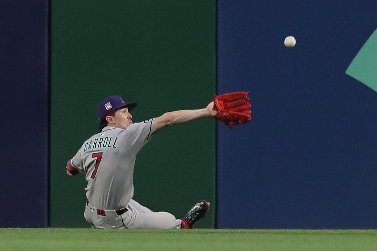 Jul 26, 2025; Pittsburgh, Pennsylvania, USA; Arizona Diamondbacks center fielder Corbin Carroll (7) makes a catch for an out against Pittsburgh Pirates third baseman Ke'Bryan Hayes (not pictured) during the fourth inning at PNC Park. Mandatory Credit: Charles LeClaire-Imagn Images