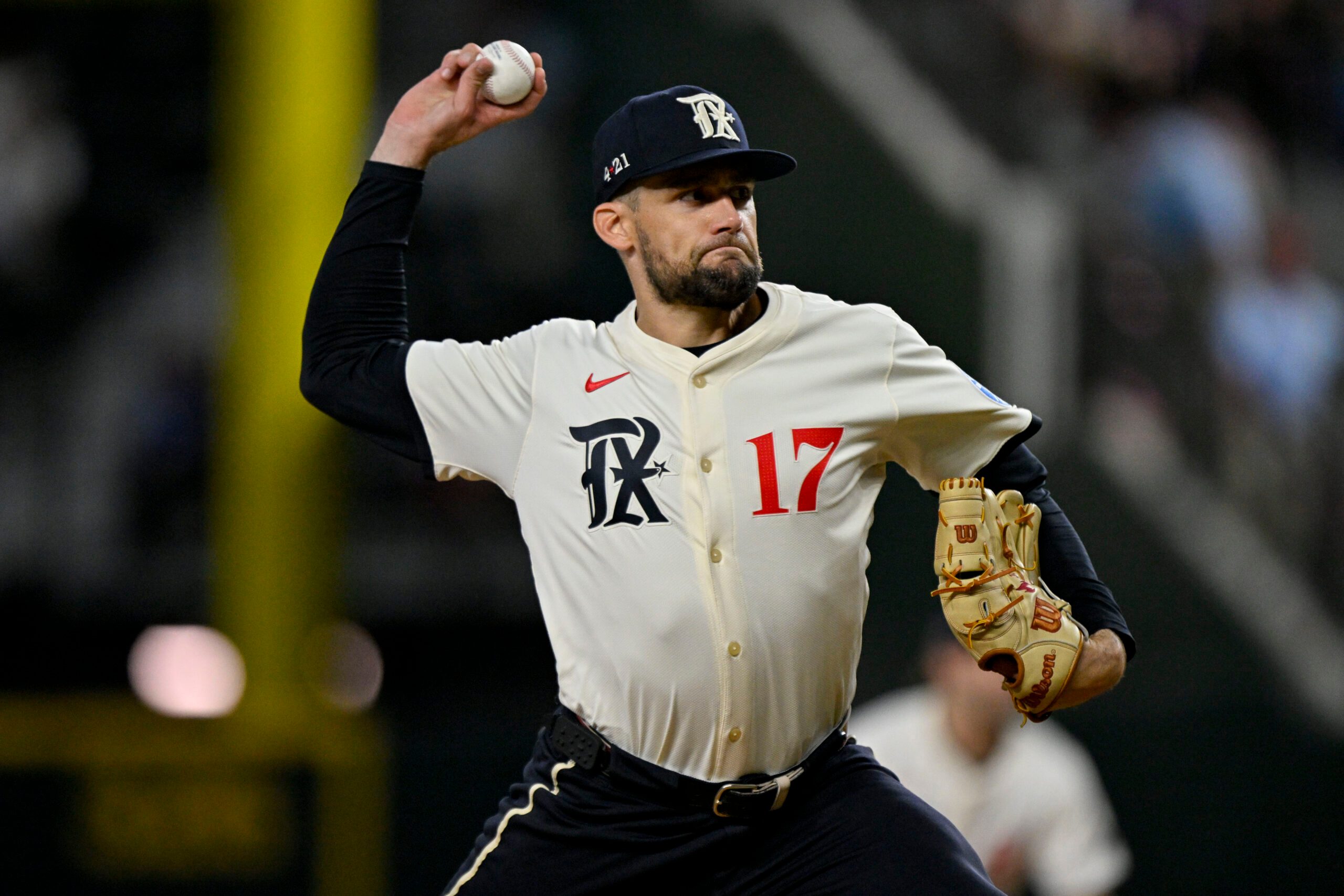 Jul 25, 2025; Arlington, Texas, USA; Texas Rangers starting pitcher Nathan Eovaldi (17) pitches during the game between the Texas Rangers and the Atlanta Braves at Globe Life Field. Mandatory Credit: Jerome Miron-Imagn Images