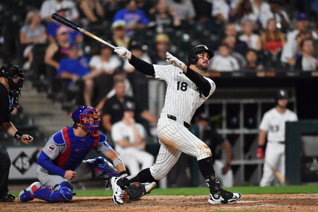 Jul 26, 2025; Chicago, Illinois, USA; Chicago White Sox right fielder Mike Tauchman (18) hits a solo home run during the ninth inning against the Chicago Cubs at Rate Field. Mandatory Credit: Patrick Gorski-Imagn Images