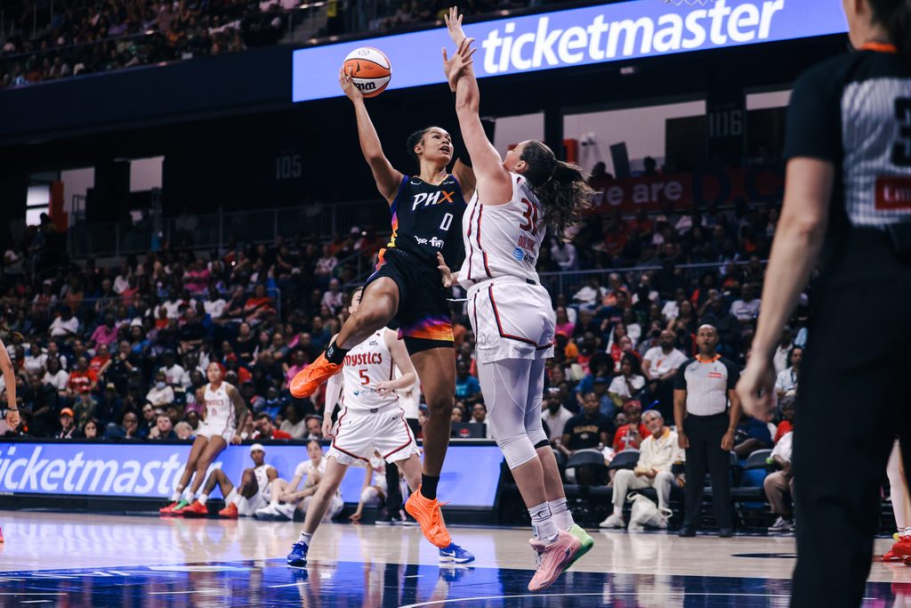 Jul 27, 2025; Washington, District of Columbia, USA; Phoenix Mercury forward Satou Sabally (0) shoots the ball while Washington Mystics center Stefanie Dolson (31) defends in the third quarter at CareFirst Arena. Mandatory Credit: Emily Faith Morgan-Imagn Images