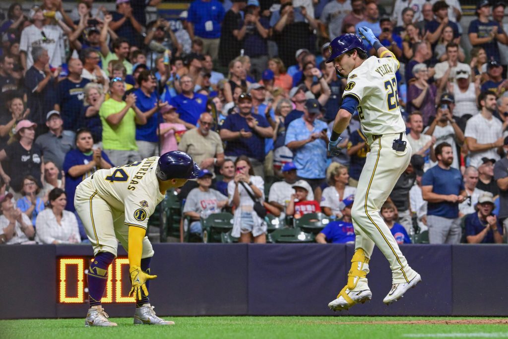 Jul 28, 2025; Milwaukee, Wisconsin, USA; Milwaukee Brewers designated hitter Christian Yelich (22) celebrates with catcher William Contreras (24) after hitting a 2-run home run in the seventh inning against the Chicago Cubs at American Family Field. Mandatory Credit: Benny Sieu-Imagn Images