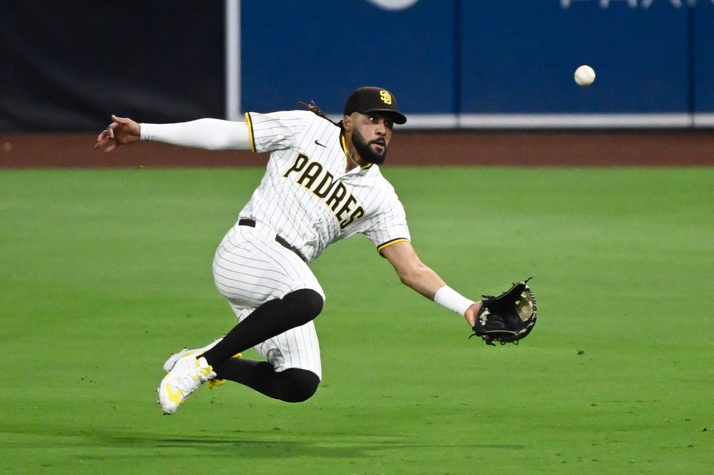 Jul 28, 2025; San Diego, California, USA; San Diego Padres right fielder Fernando Tatis Jr. (23) makes a catch on a ball hit by New York Mets third baseman Ronny Mauricio (10) during the sixth inning at Petco Park. Mandatory Credit: Denis Poroy-Imagn Images