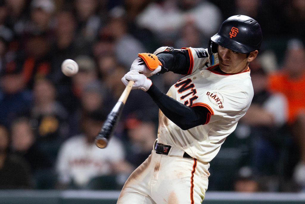 Jul 28, 2025; San Francisco, California, USA; San Francisco Giants center fielder Jung Hoo Lee (51) connects for an RBI single against the Pittsburgh Pirates during the ninth inning at Oracle Park. Mandatory Credit: D. Ross Cameron-Imagn Images