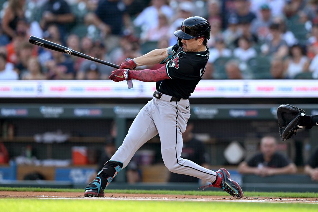 Jul 29, 2025; Detroit, Michigan, USA;  Arizona Diamondbacks right fielder Corbin Carroll (7) hits a leadoff triple against the Detroit Tigers in the first inning at Comerica Park. Mandatory Credit: Lon Horwedel-Imagn Images