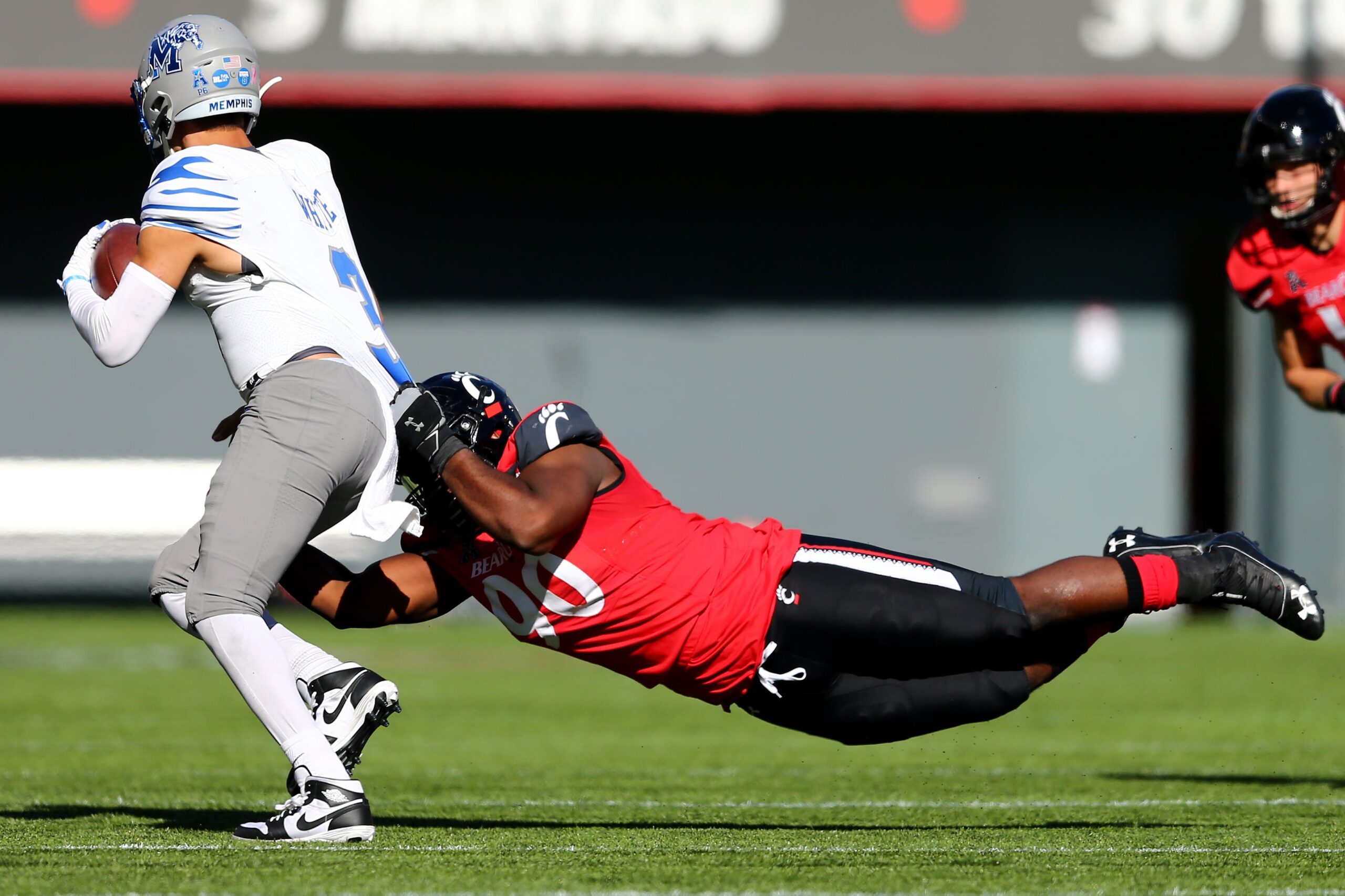 Oct 31, 2020; Cincinnati, OH, USA; Cincinnati Bearcats defensive tackle Jabari Taylor (90) sacks Memphis Tigers quarterback Brady White (3) during the fourth quarter of a college football game, Saturday, Oct. 31, 2020, at Nippert Stadium in Cincinnati. The Cincinnati Bearcats won 49-10.  Mandatory Credit: Kareem Elgazzar-USA TODAY NETWORK

Ncaa Football Memphis At Cincinnati