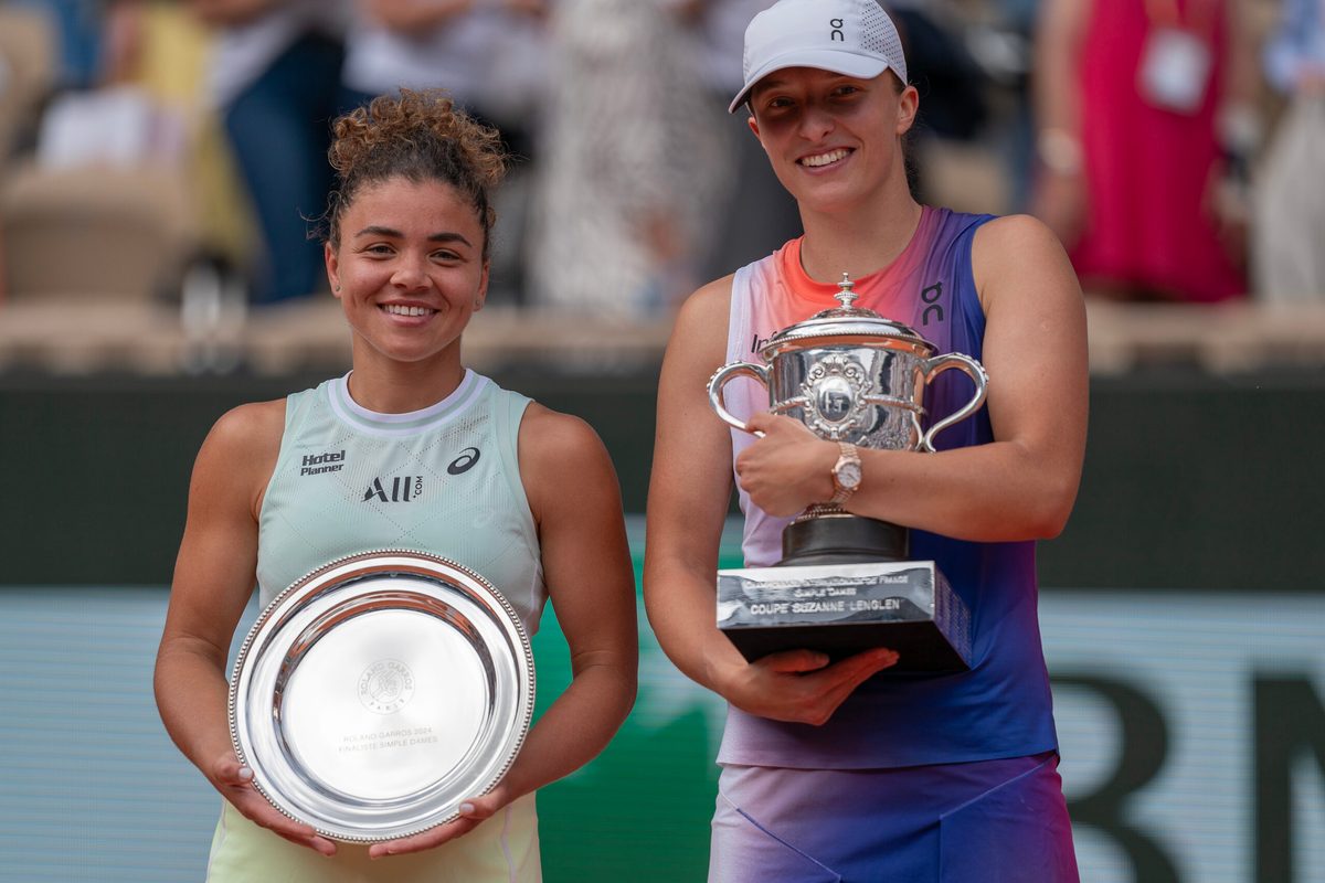 Jun 8, 2024; Paris, France; Iga Swiatek of Poland and Jasmine Paolini of Italy pose with their trophies after the womenís final on day 14 of Roland Garros at Stade Roland Garros. Mandatory Credit: Susan Mullane-Imagn Images