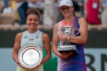 Jun 8, 2024; Paris, France; Iga Swiatek of Poland and Jasmine Paolini of Italy pose with their trophies after the womenís final on day 14 of Roland Garros at Stade Roland Garros. Mandatory Credit: Susan Mullane-Imagn Images