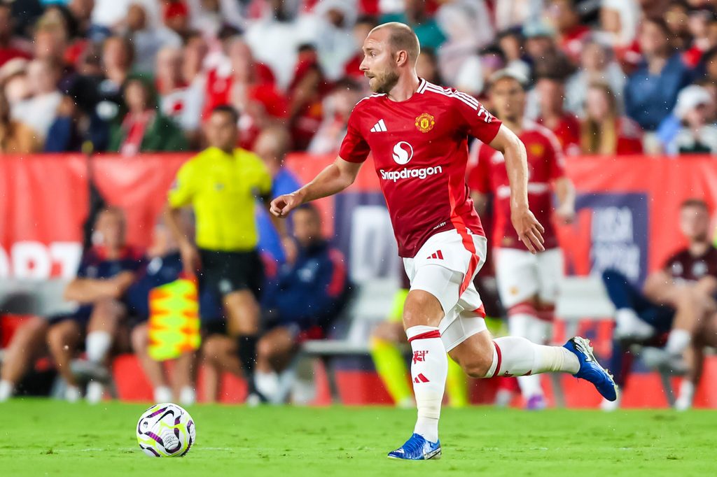 Aug 3, 2024; Columbia, South Carolina, USA; Manchester United midfielder Christian Eriksen (14) brings the ball up against Liverpool in the second half at Williams-Brice Stadium. Mandatory Credit: Jeff Blake-Imagn Images