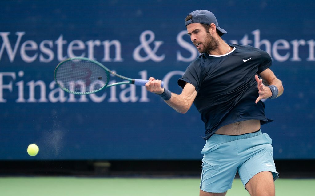 Aug 15, 2024; Cincinnati, OH, USA ; Karen Khachanov returns a shot against Alexander Zverev of Germany on day four of the Cincinnati Open. Mandatory Credit: Susan Mullane-Imagn Images