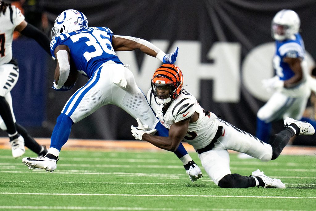 Cincinnati Bengals cornerback Josh Newton (28) attempts to tackle Indianapolis Colts running back Demetric Felton (36) in the fourth quarter of the NFL preseason game at Paycor Stadium in Cincinnati on Thursday, Aug. 22, 2024.