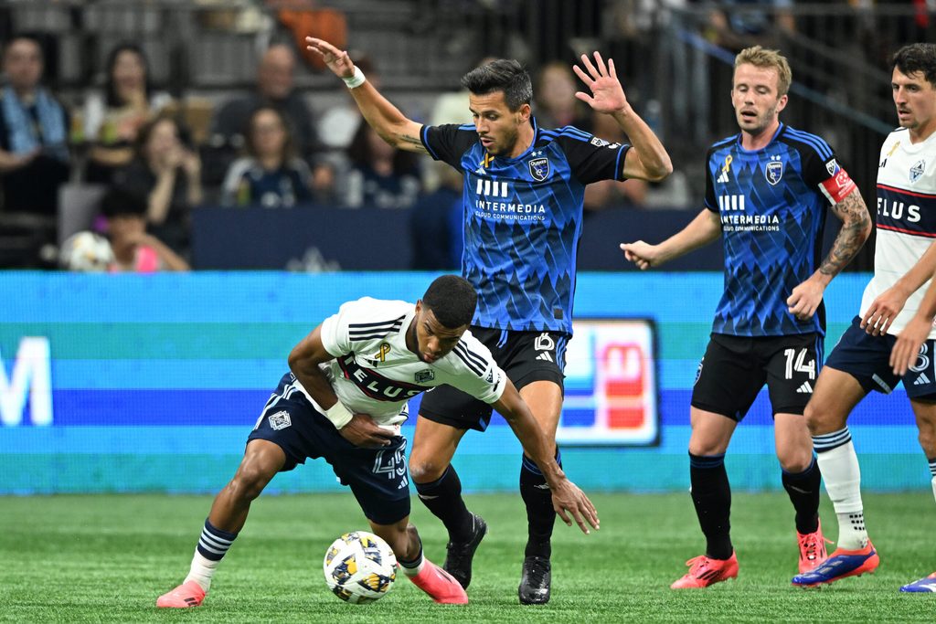 Sep 14, 2024; Vancouver, British Columbia, CAN; Vancouver Whitecaps FC midfielder Pedro Vite (45) and San Jose Earthquakes midfielder Alfredo Morales (6) battle for the ball in the second half at BC Place. Mandatory Credit: Anne-Marie Sorvin-Imagn Images