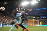 Sep 28, 2024; Saint Paul, Minnesota, USA; Colorado Rapids forward Kimani Stewart-Baynes (27) and Minnesota United midfielder Carlos Harvey (67) fight for possession in the second half at Allianz Field. Mandatory Credit: Matt Blewett-Imagn Images