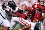 Oklahoma Sooners running back Taylor Tatum (8) runs past South Carolina Gamecocks defensive tackle Nick Barrett (93) during a college football game between the University of Oklahoma Sooners (OU) and the South Carolina Gamecocks at Gaylord Family - Oklahoma Memorial Stadium in Norman, Okla., Saturday, Oct. 19, 2024.