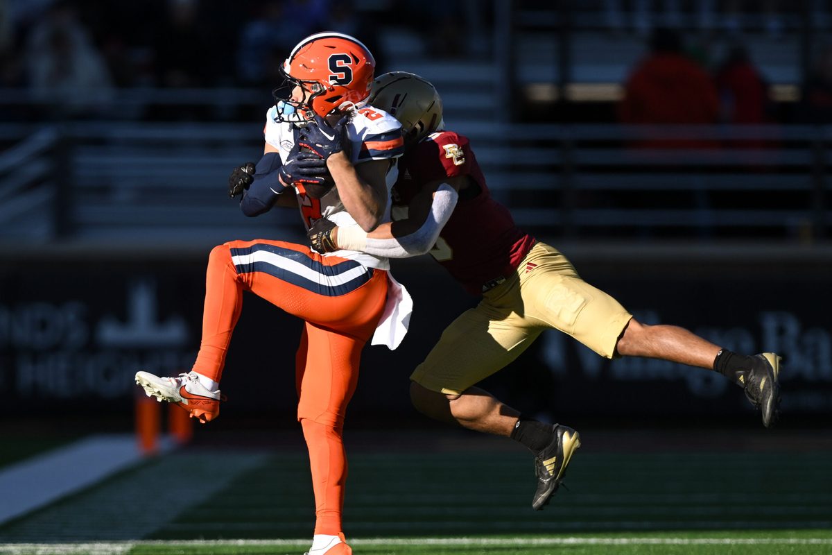 Nov 9, 2024; Chestnut Hill, Massachusetts, USA; Syracuse Orange wide receiver Trebor Pena (2) makes a catch in front of Boston College Eagles defensive back Khari Johnson (3) during the second half at Alumni Stadium. Mandatory Credit: Brian Fluharty-Imagn Images