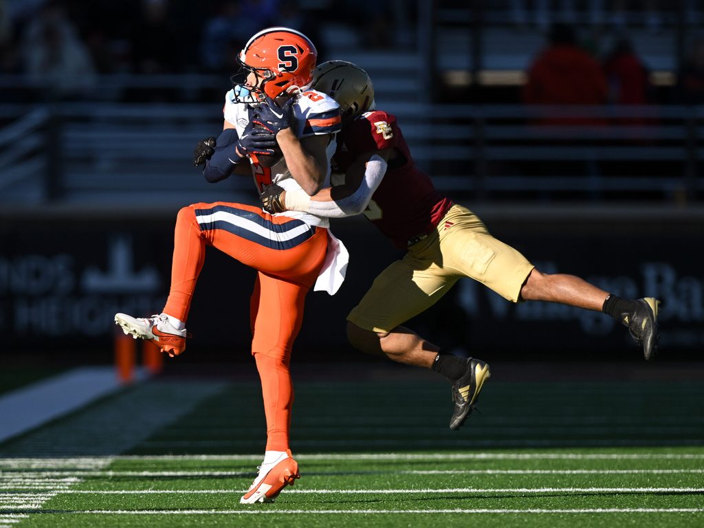 Nov 9, 2024; Chestnut Hill, Massachusetts, USA; Syracuse Orange wide receiver Trebor Pena (2) makes a catch in front of Boston College Eagles defensive back Khari Johnson (3) during the second half at Alumni Stadium. Mandatory Credit: Brian Fluharty-Imagn Images