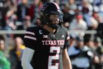 Nov 30, 2024; Lubbock, Texas, USA;  Texas Tech Red Raiders quarterback Behren Morton (2) in the first half during the game against the West Virginia Mountaineers at Jones AT&T Stadium and Cody Campbell Field. Mandatory Credit: Michael C. Johnson-Imagn Images