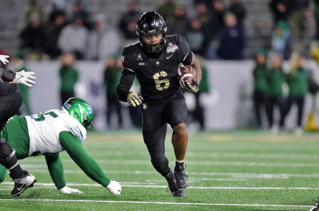 Dec 6, 2024; West Point, NY, USA; Army Black Knights running back Kanye Udoh (6) runs the ball against the Tulane Green Wave during the second half at Michie Stadium. Mandatory Credit: Danny Wild-Imagn Images