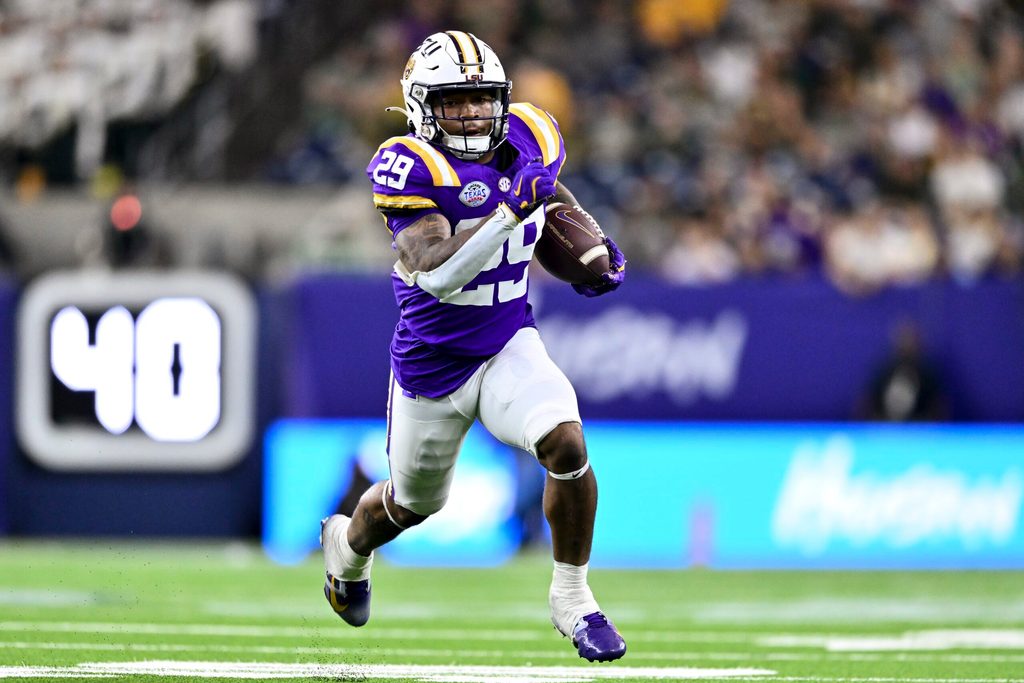 Dec 31, 2024; Houston, TX, USA; LSU Tigers running back Caden Durham (29) runs the ball during the second half against the Baylor Bears at NRG Stadium. The Tigers defeat the Bears 44-31. Mandatory Credit: Maria Lysaker-Imagn Images