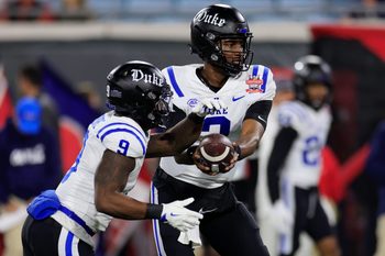 (EDITORÕS NOTE: Resubmitted with alternate crop.) Duke Blue Devils quarterback Henry Belin IV (3) hands off to running back Jaquez Moore (9) before the TaxSlayer Gator Bowl Thursday, Jan. 2, 2025 at EverBank Stadium in Jacksonville, Fla. [Corey Perrine/Florida Times-Union]
