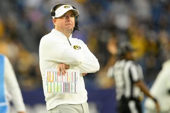 Dec 30, 2024; Nashville, TN, USA;  Missouri Tigers head coach Eliah Drinkwitz watches the clock against the Iowa Hawkeyes during the second half at Nissan Stadium. Mandatory Credit: Steve Roberts-Imagn Images