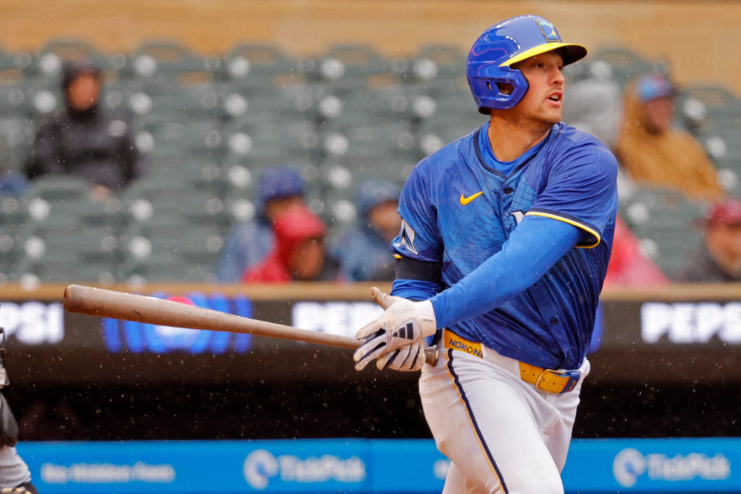 Apr 24, 2025; Minneapolis, Minnesota, USA; Minnesota Twins third baseman Brooks Lee (2) singles against the Chicago White Sox in the fifth inning at Target Field. Mandatory Credit: Bruce Kluckhohn-Imagn Images