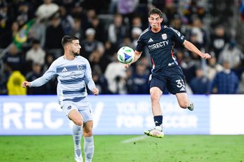 May 17, 2025; San Diego, California, USA; San Diego FC defender Oscar Verhoeven (33) fights for the ball with Sporting Kansas City defender Robert Voloder (4) during the first half  at Snapdragon Stadium. Mandatory Credit: Denis Poroy-Imagn Images