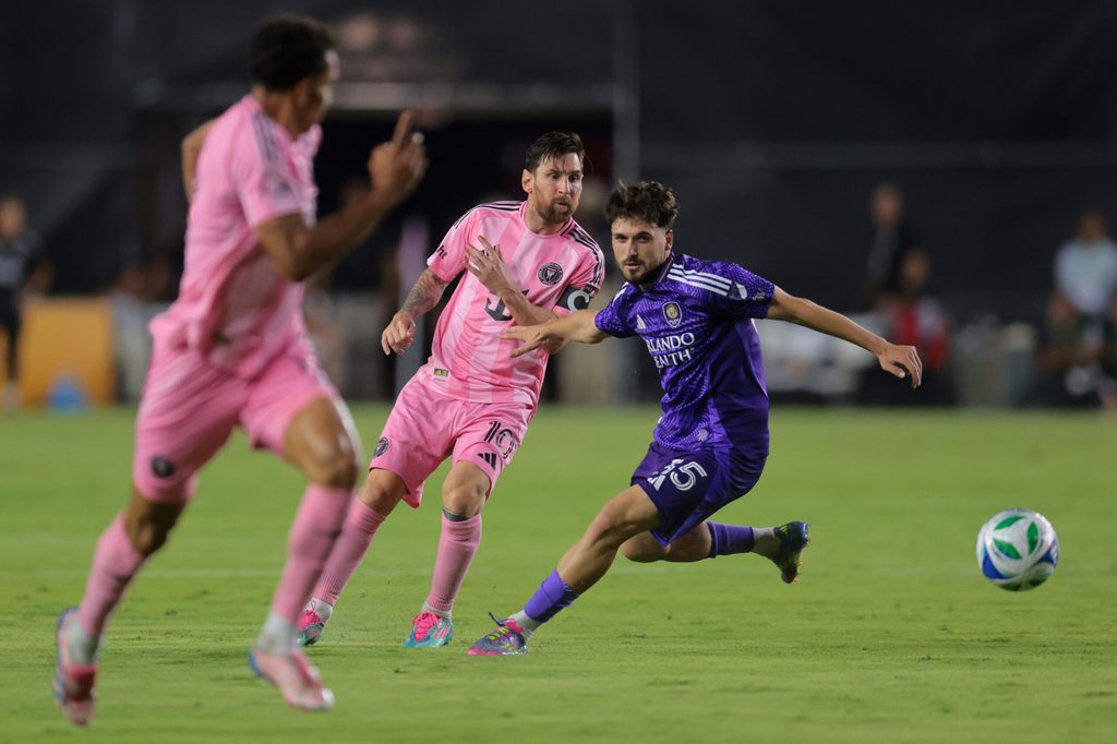 May 18, 2025; Fort Lauderdale, Florida, USA; Inter Miami CF forward Lionel Messi (10) passes the ball as Orlando City midfielder Joran Gerbet (35) defends during the second half at Chase Stadium. Mandatory Credit: Sam Navarro-Imagn Images
