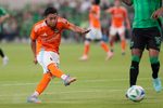 May 21, 2025; Austin, Texas, USA; Houston FC midfielder Erik Duenas (16) shoots on goal during the second half against Austin FC at Q2 Stadium. Mandatory Credit: Scott Wachter-Imagn Images