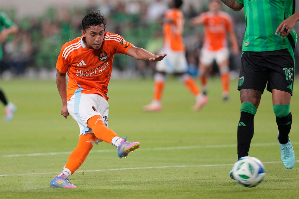 May 21, 2025; Austin, Texas, USA; Houston FC midfielder Erik Duenas (16) shoots on goal during the second half against Austin FC at Q2 Stadium. Mandatory Credit: Scott Wachter-Imagn Images