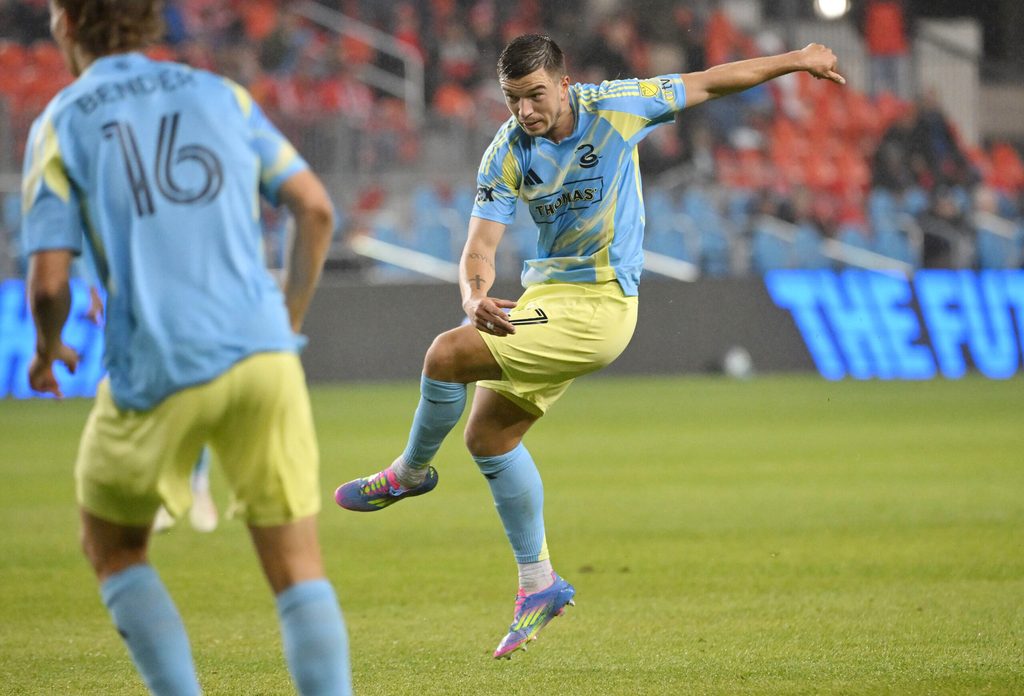 May 28, 2025; Toronto, Ontario, CAN; Philadelphia Union defender Kai Wagner (27) shoots the ball to score the winning goal against Toronto FC in the second half at BMO Field. Mandatory Credit: Dan Hamilton-Imagn Images