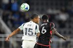May 28, 2025; Washington, District of Columbia, USA; New England Revolution midfielder Brandon Bye (15) and D.C. United midfielder Boris Enow (6) go after the ball during the second half of the game at Audi Field. Mandatory Credit: Hannah Foslien-Imagn Images