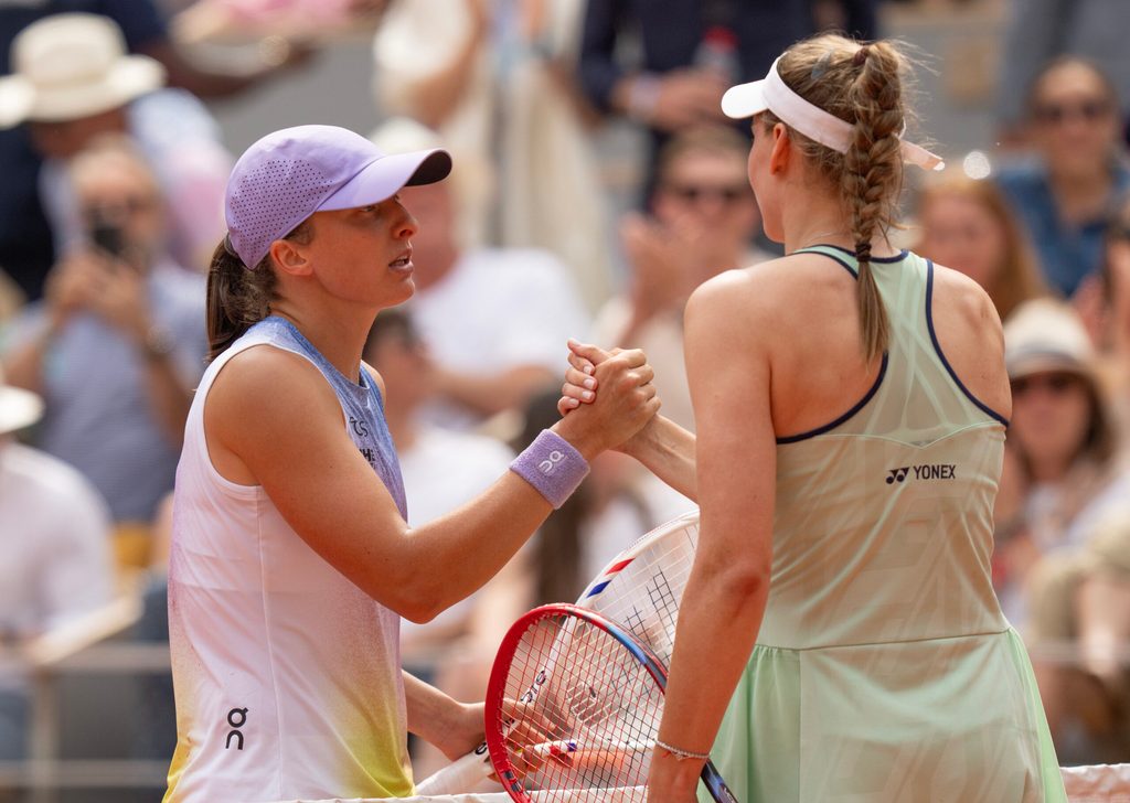 Jun 1, 2025; Paris, FR; Iga Swiatek of Poland at the net with Elena Rybakina of Kazakhstan after their match on day eight at Roland Garros Stadium. Mandatory Credit: Susan Mullane-Imagn Images
